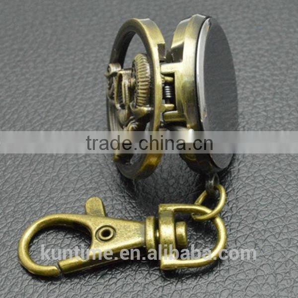 Bronze vintage watch with keychain decorate with motorbike