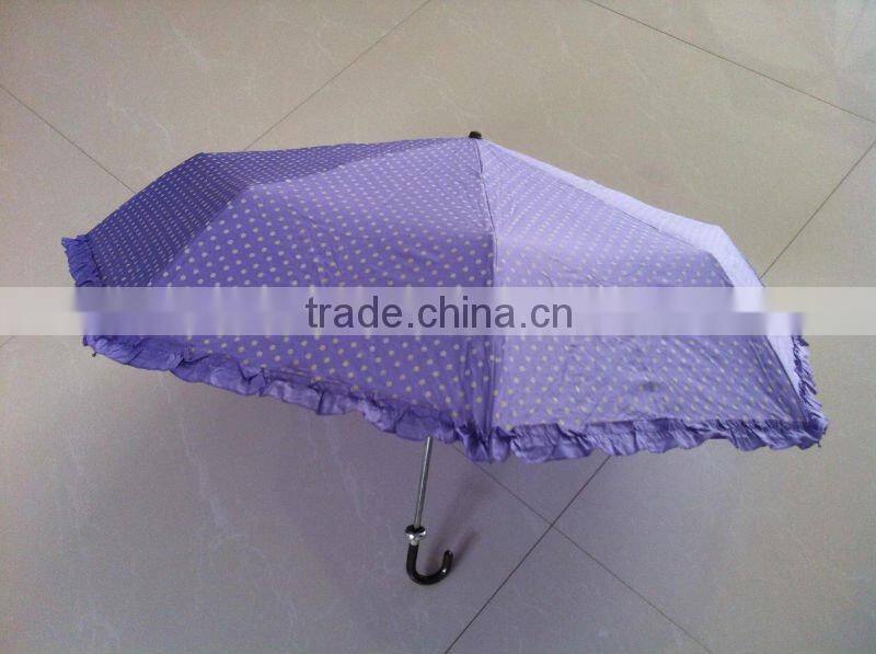 Beautiful lady folding umbrella