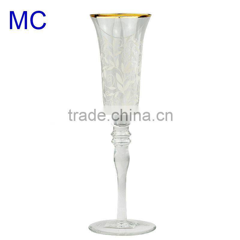 Gold rimmed champagne glass with etched flower