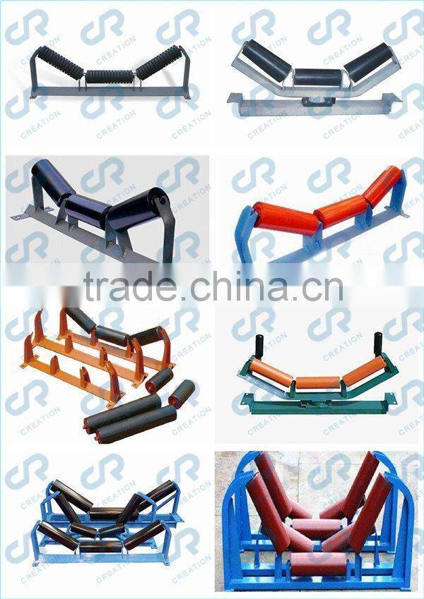 Return idler rollers with spaced rubber rings