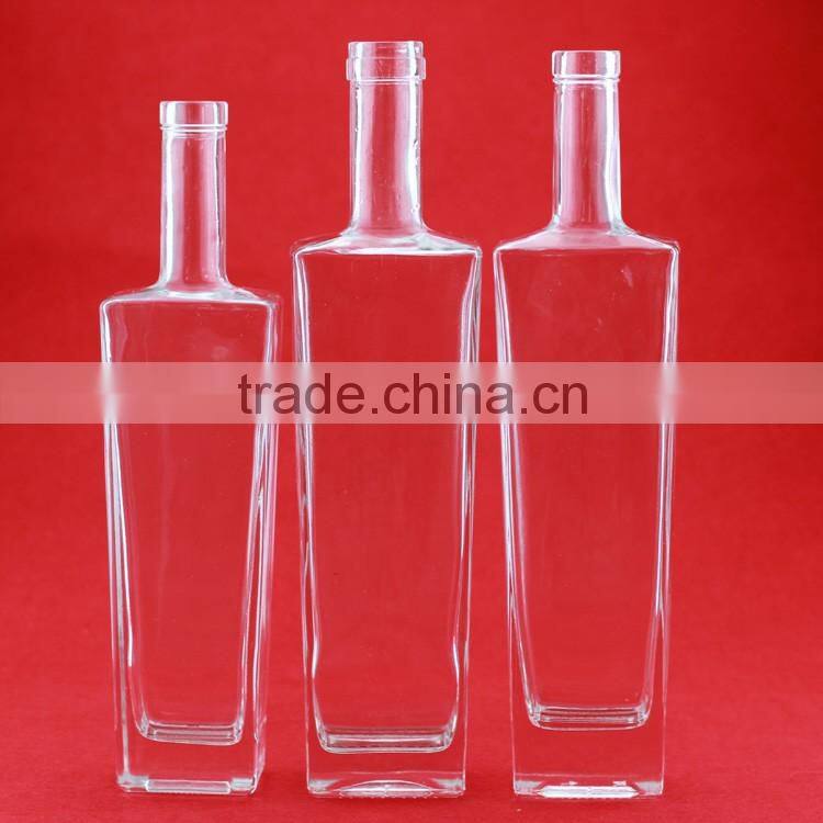 Hot selling cheap embossed spirit bottles glass vodka bottles 700ml french brandy bottle with cork