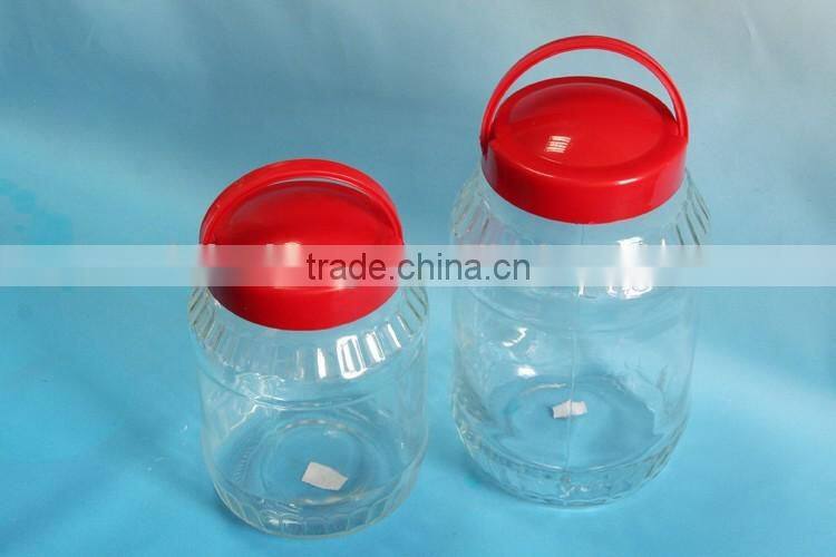 big glass liquid storage bottle with plastic hanging lid