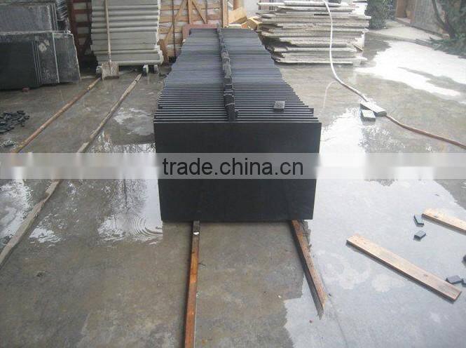 bush hammered black sandstone tile