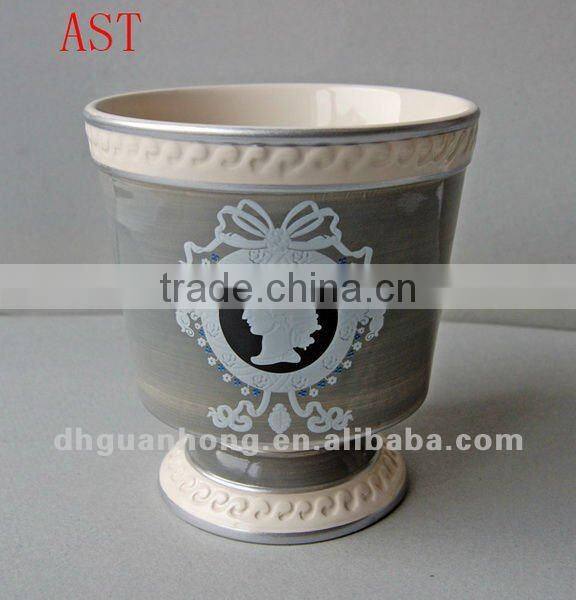 Stock ceramic flower pot in pink color round shape