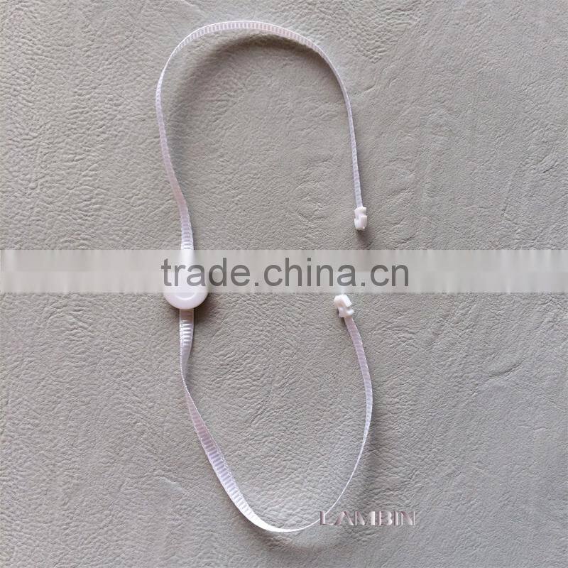 Double insertion crystal string seal tag for high end garments