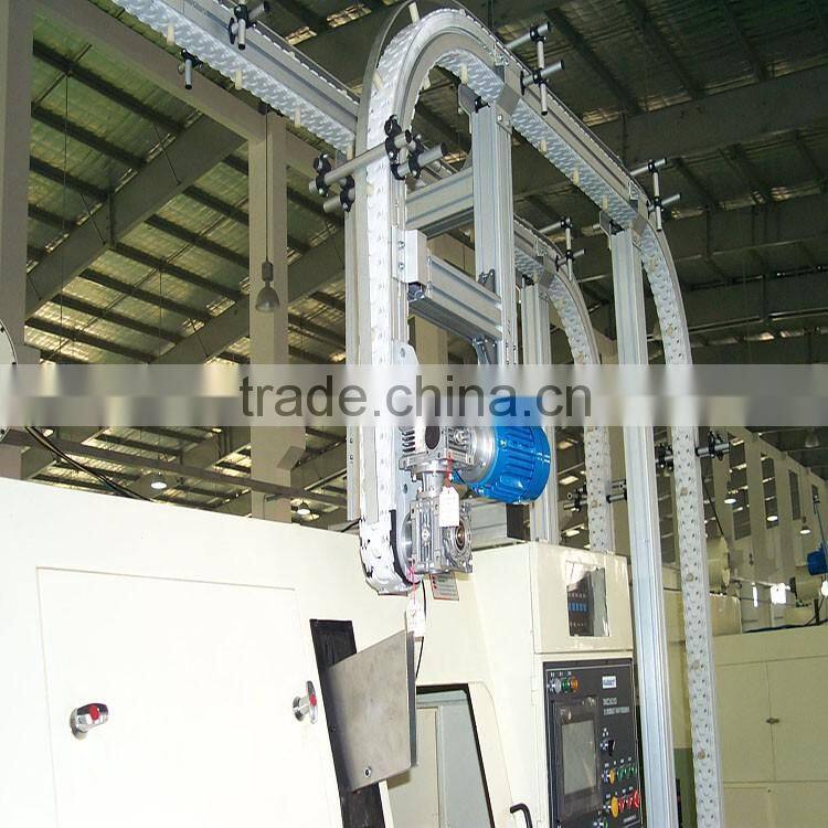 Vertical bottle clamping conveyors system
