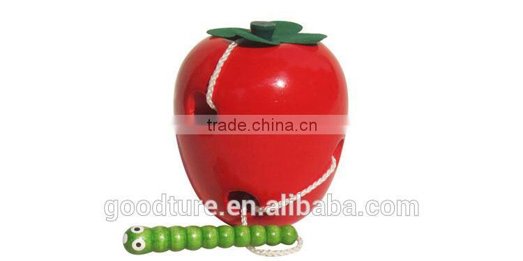 Wooden Caterpillar Eating Red Apple