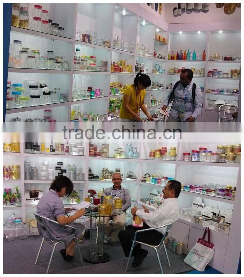 glass spice jar with wooden lid and spoon