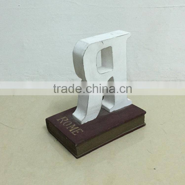 Polyresin book with letter statue
