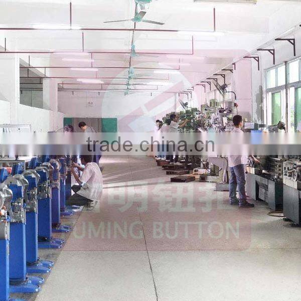 Jeans button attaching machine