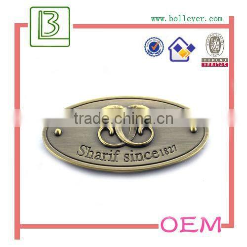 metal oval shaped logo patch