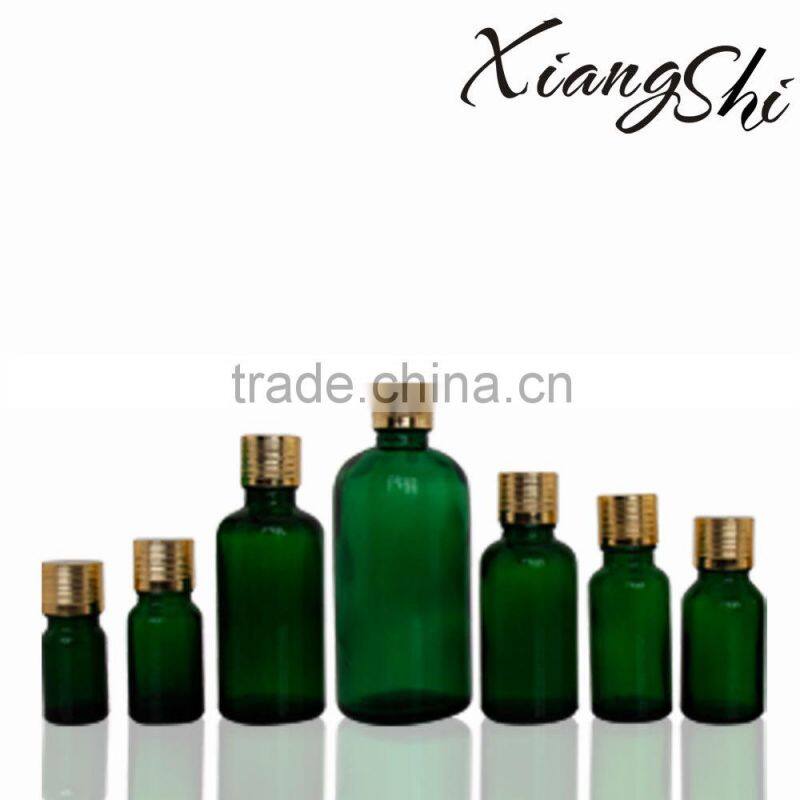 transparent green glass essential oil bottles factory with gold cap