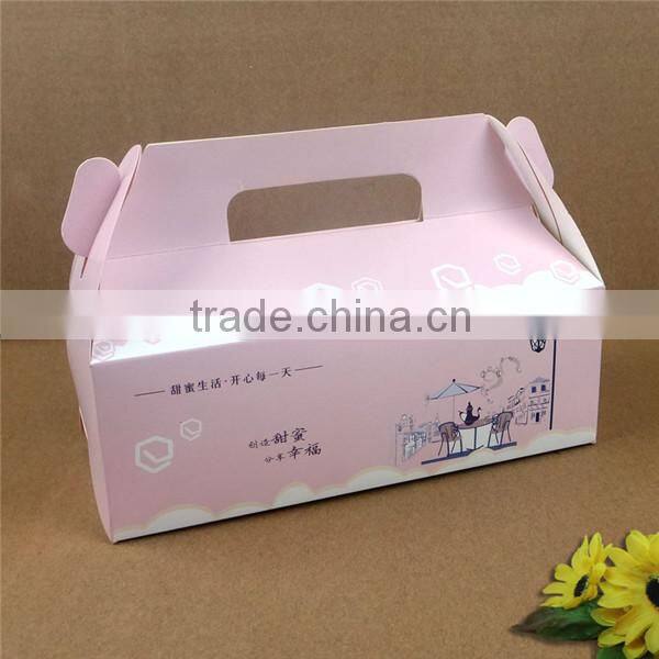 white or brown cakebox with handle