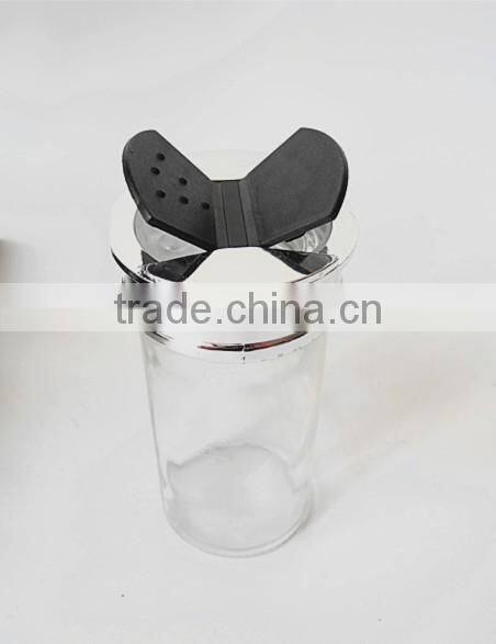 small clear glass paragon spice jars with butterfly cap