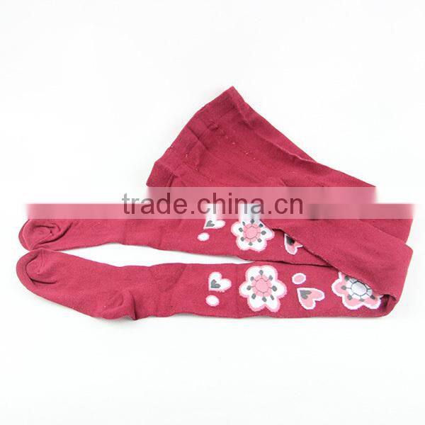 Red colored girls tight leggings with fashion flowers