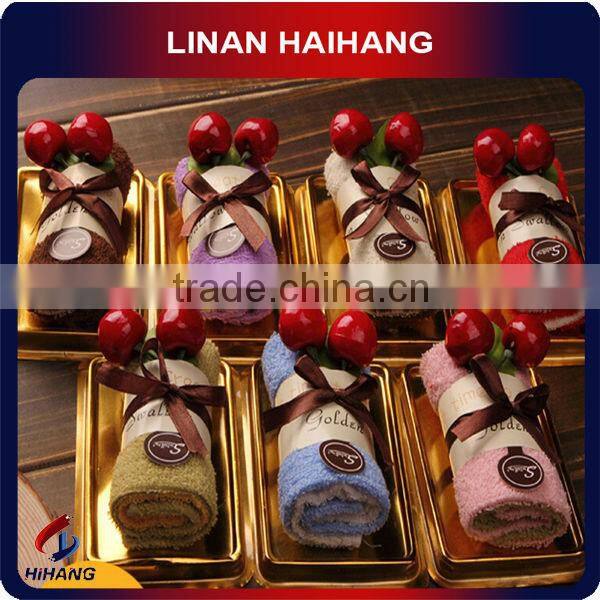 China OEM manufacture hot selling 100% cotton towel cake souvenir