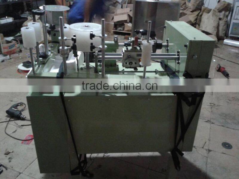 Automatic tape rolling machine