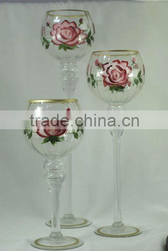 green colored goblet glass candle holder