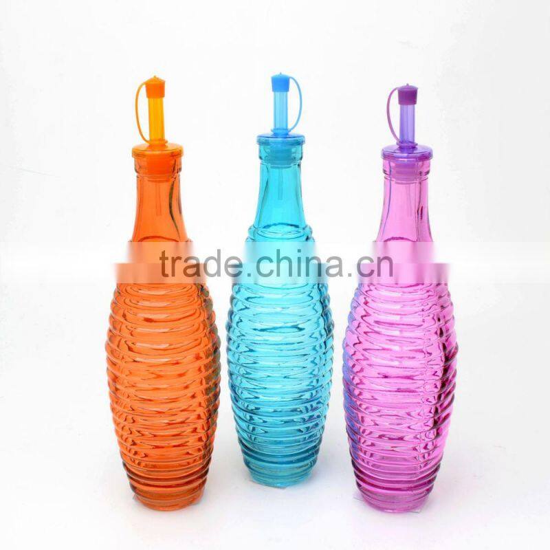 colored glass olive oil and vinegar bottle