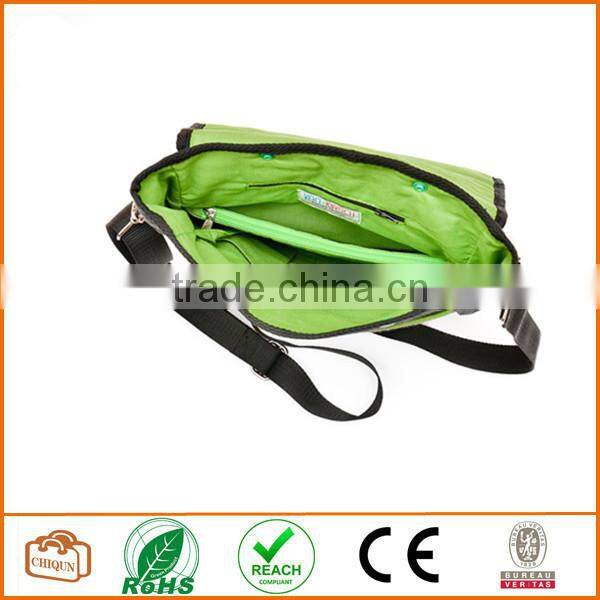 Unisex messenger bag and backpack. Grey Wool-Polyester mix with green details and lining. Multiple pockets