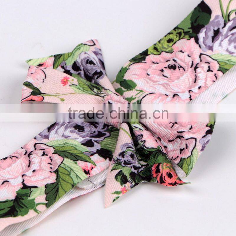 Red christmas ribbon bow with adhesive tape