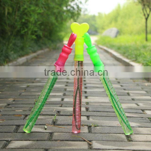 Happy wedding party soap bubble water in tube with heart wand