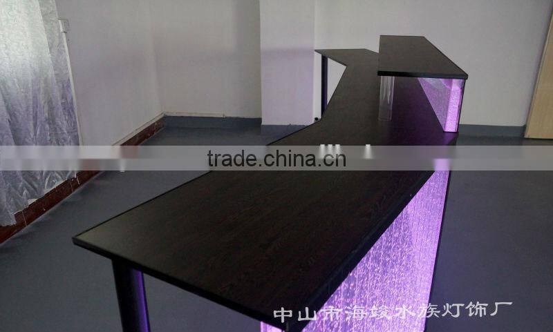 fatastic hotel frond desk receiption with led lights and water bubble moving.