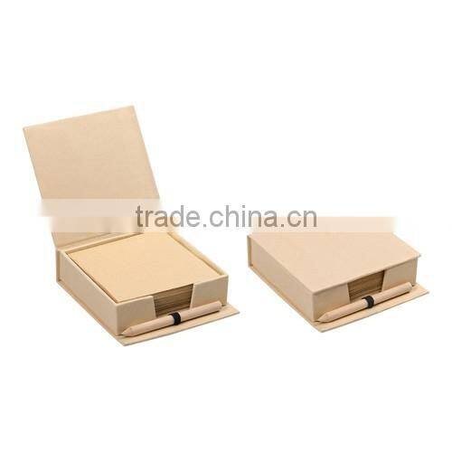 box containing memo sheets and mini pencil