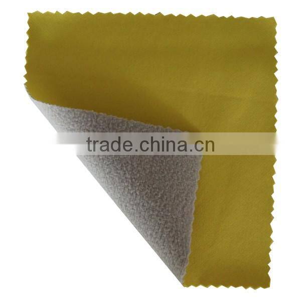 Polyester water resistant softshell fabric with fleece lining