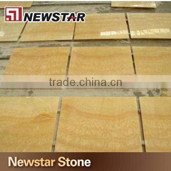Backlit transparent honey yellow onyx marble tiles