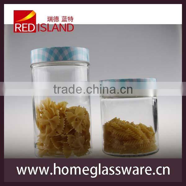 Hand decorated glass storage jar with design metal lid