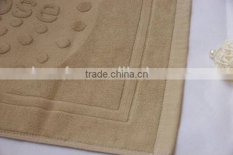 100% cotton bath mat, jacquard design with border edges, solid dyed color