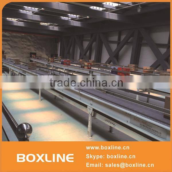 Flexible mesh conveyor for heavy cartons
