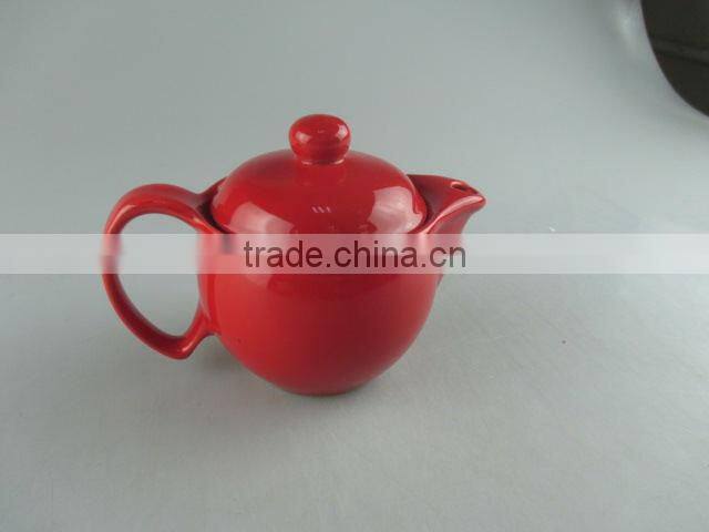 Glazed red round porcelain teapot in stock