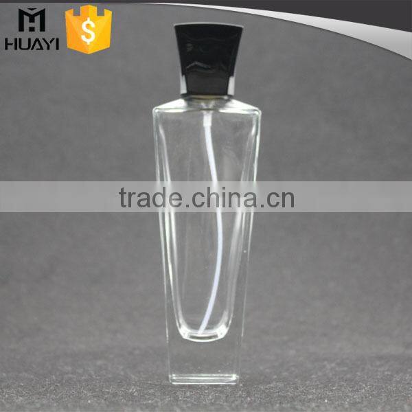empty perfume bottle glass with black cap