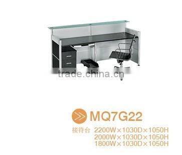 Black tufted reception desk made with tempered glass