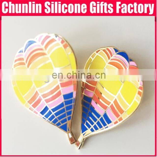 carved lapel pin with resin