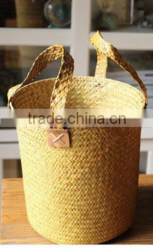basket made of natural straw seagrass for housewaring with handle and lining