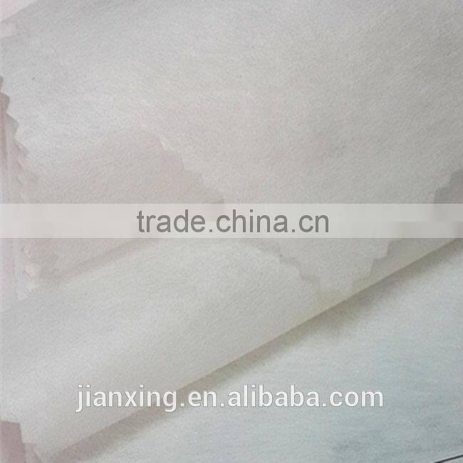 Hot and cold water soluble adhesive interlining for garment embroidery