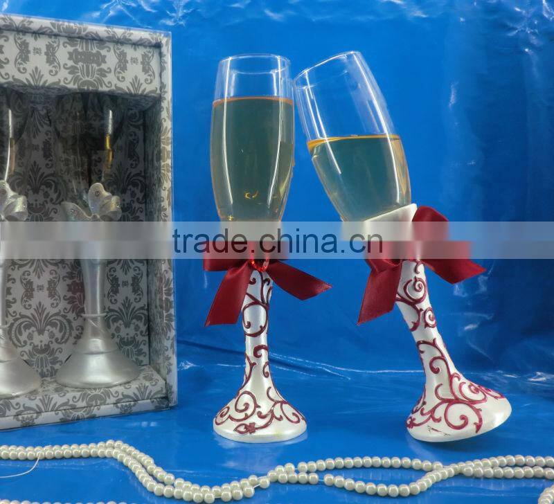 with red ribbon resin decorative champagne toasting flutes