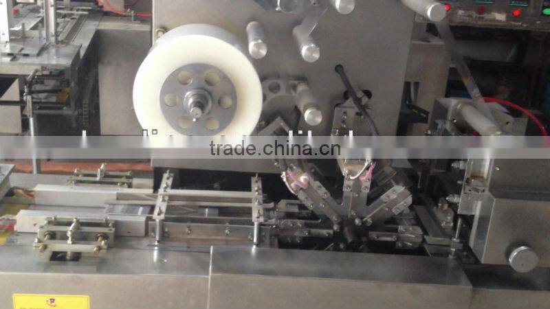 Automatic cellophane overwrapping machine