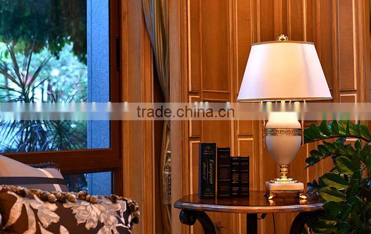 Graceful white color jade body brass bottom home use table lamp with fabric lampshade