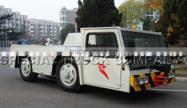 airplane aircraft dragging towing tractor