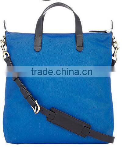 blue fabric small tote shopper bag with black smooth leather trim