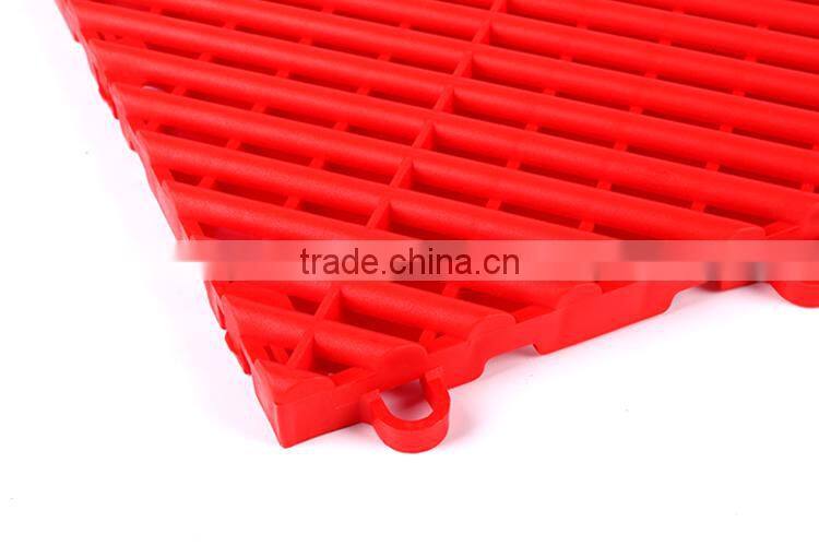 Anti-slip and fluid drainage interlocking plastic floor tiles for store rooms