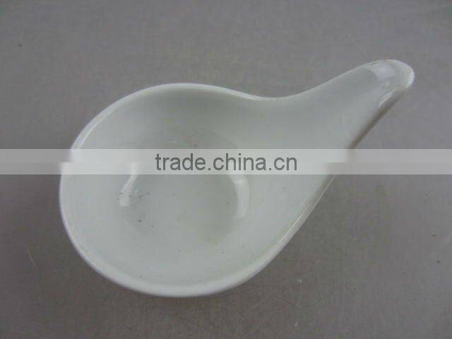 Stock white porcelain spoon shaped sauce dish