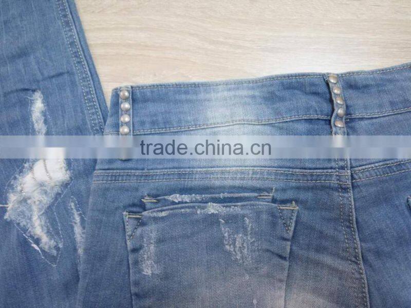 GZY cheap woman fashion Stocklots Women scratch jeans factory