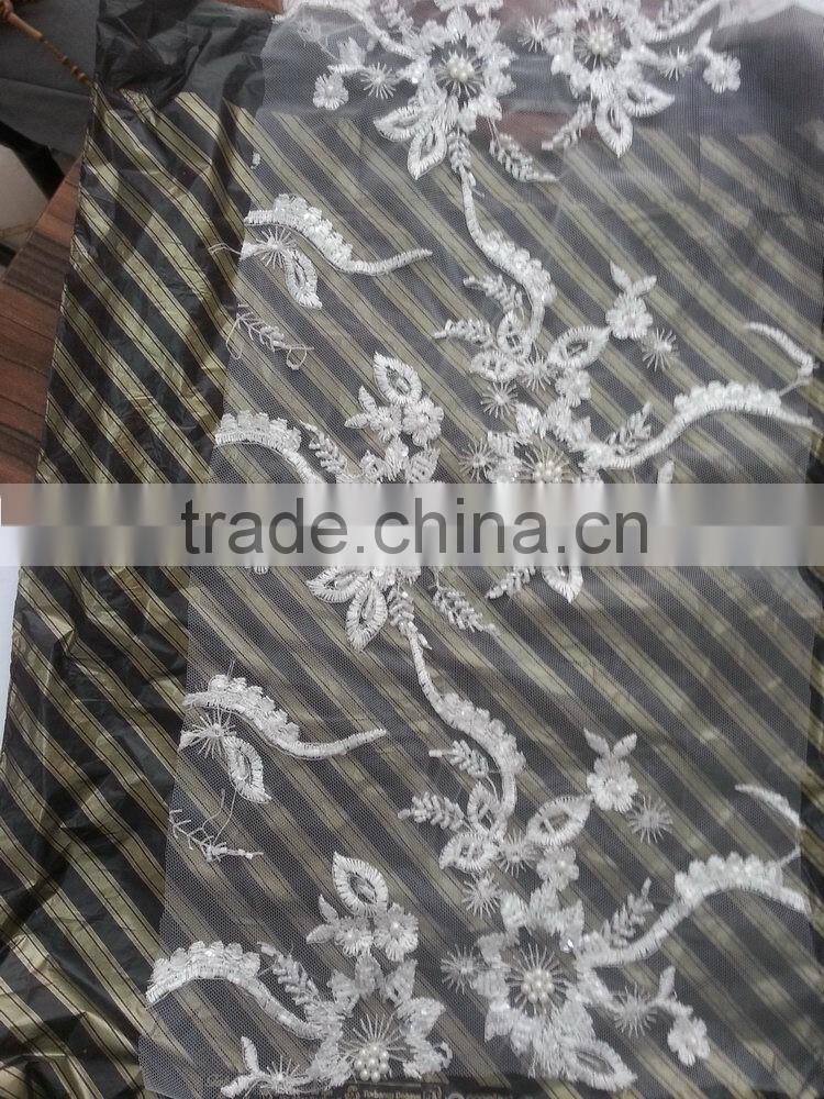 Low price promotional net cord lace fabric