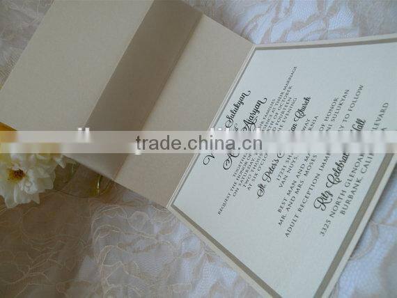 Ivory wedding invitation with bow