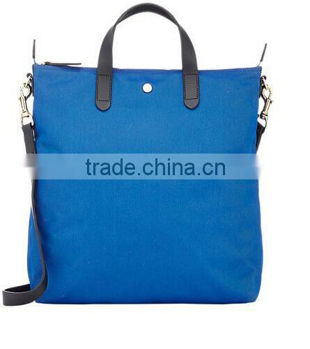 blue fabric small tote shopper bag with black smooth leather trim